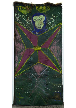 Illustration for article titled Why Does This Comic Book Hero Appear On So Many New Guinea War Shields?